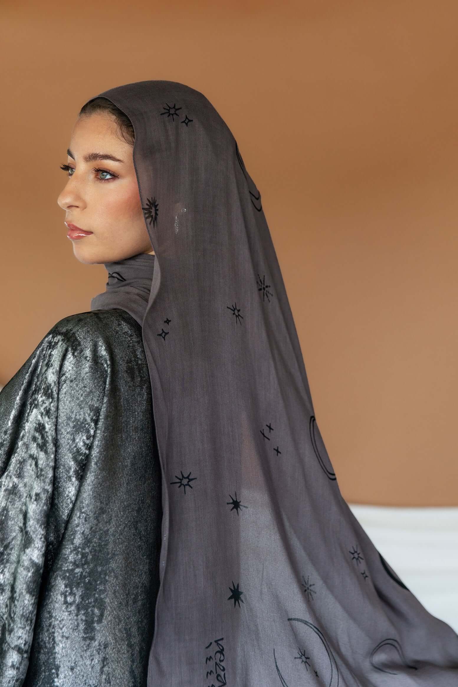 Celestial print hijab designed with subtle lunar accents and breathable woven texture