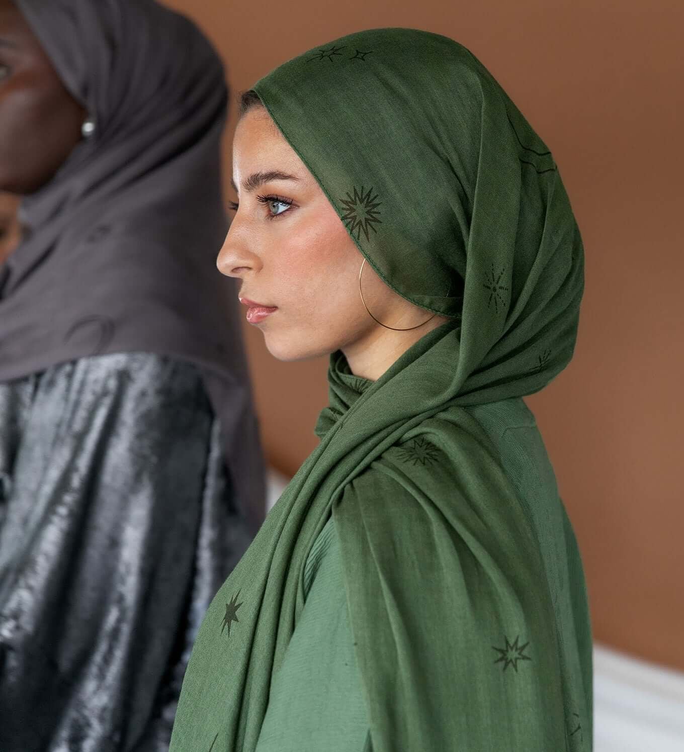 Celestial print hijab featuring lunar and star motifs on soft, breathable fabric.