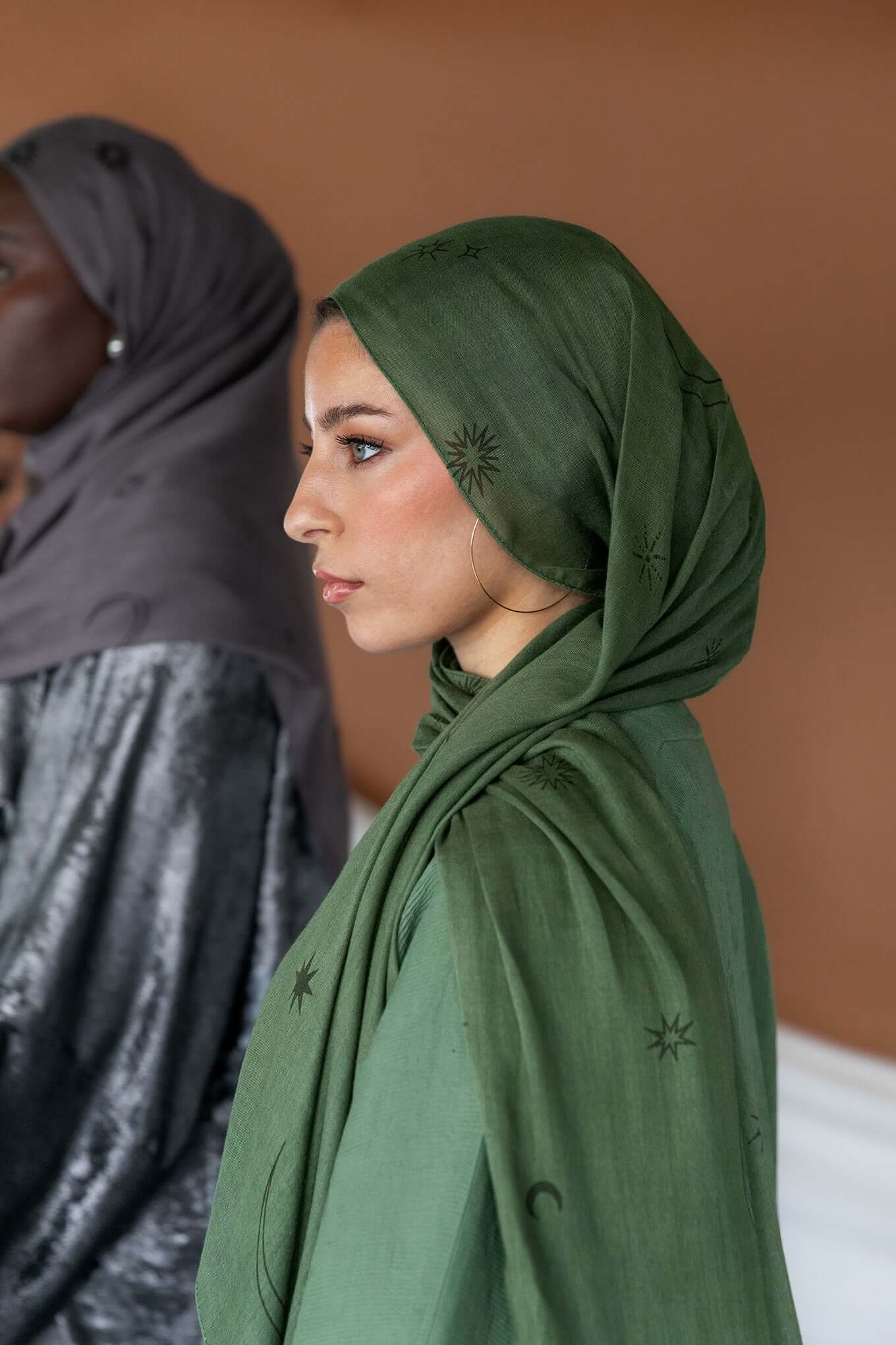 Celestial print hijab featuring lunar and star motifs on soft, breathable fabric.