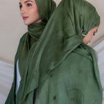 Woven modal hijab with star and moon print, inspired by peaceful Ramadan nights.