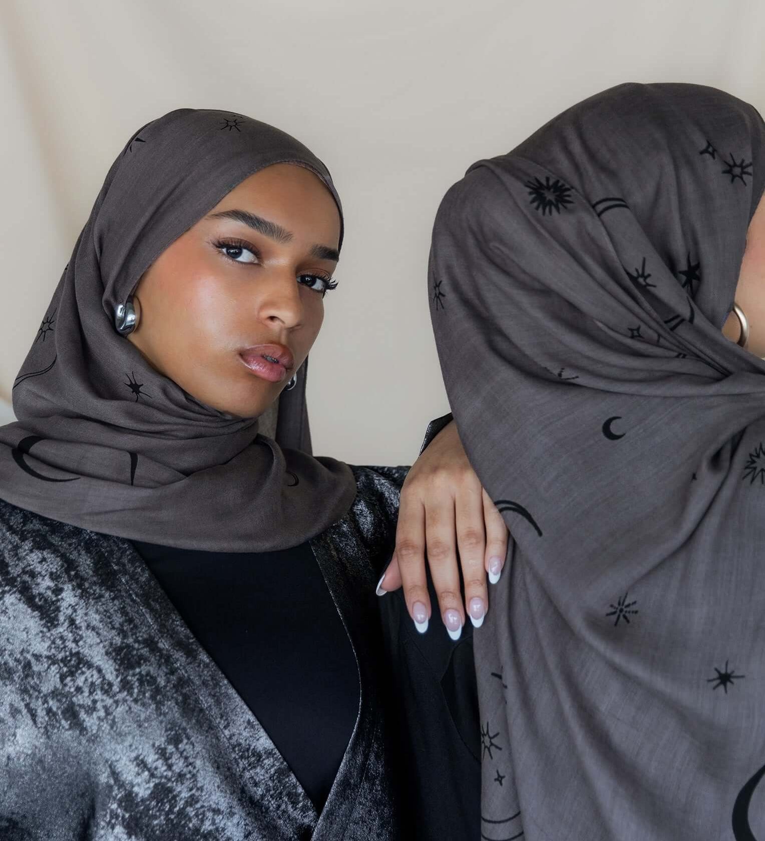 Woven modal hijab featuring crescent moon and star motifs for a celestial touch.
