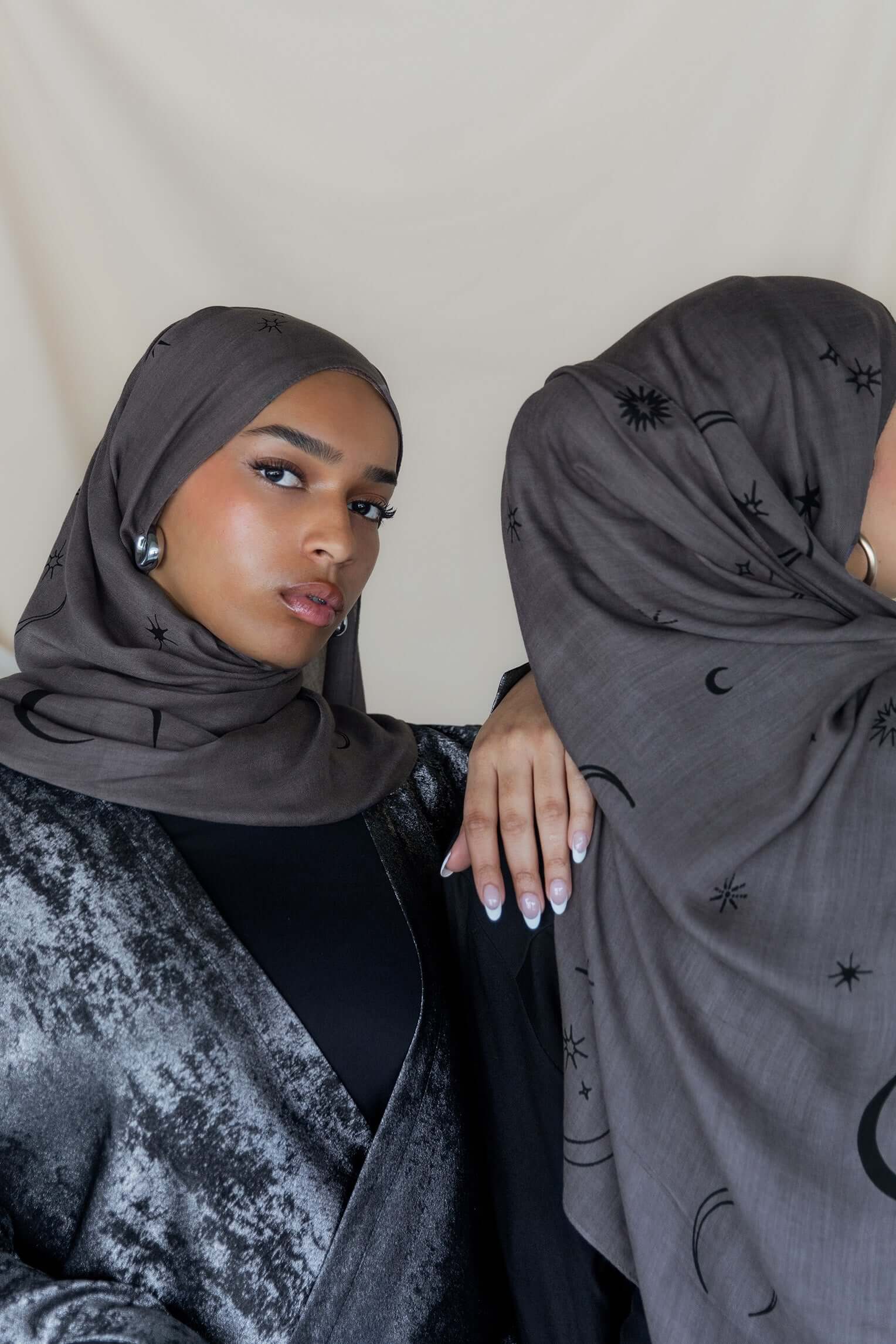 Woven modal hijab featuring crescent moon and star motifs for a celestial touch.