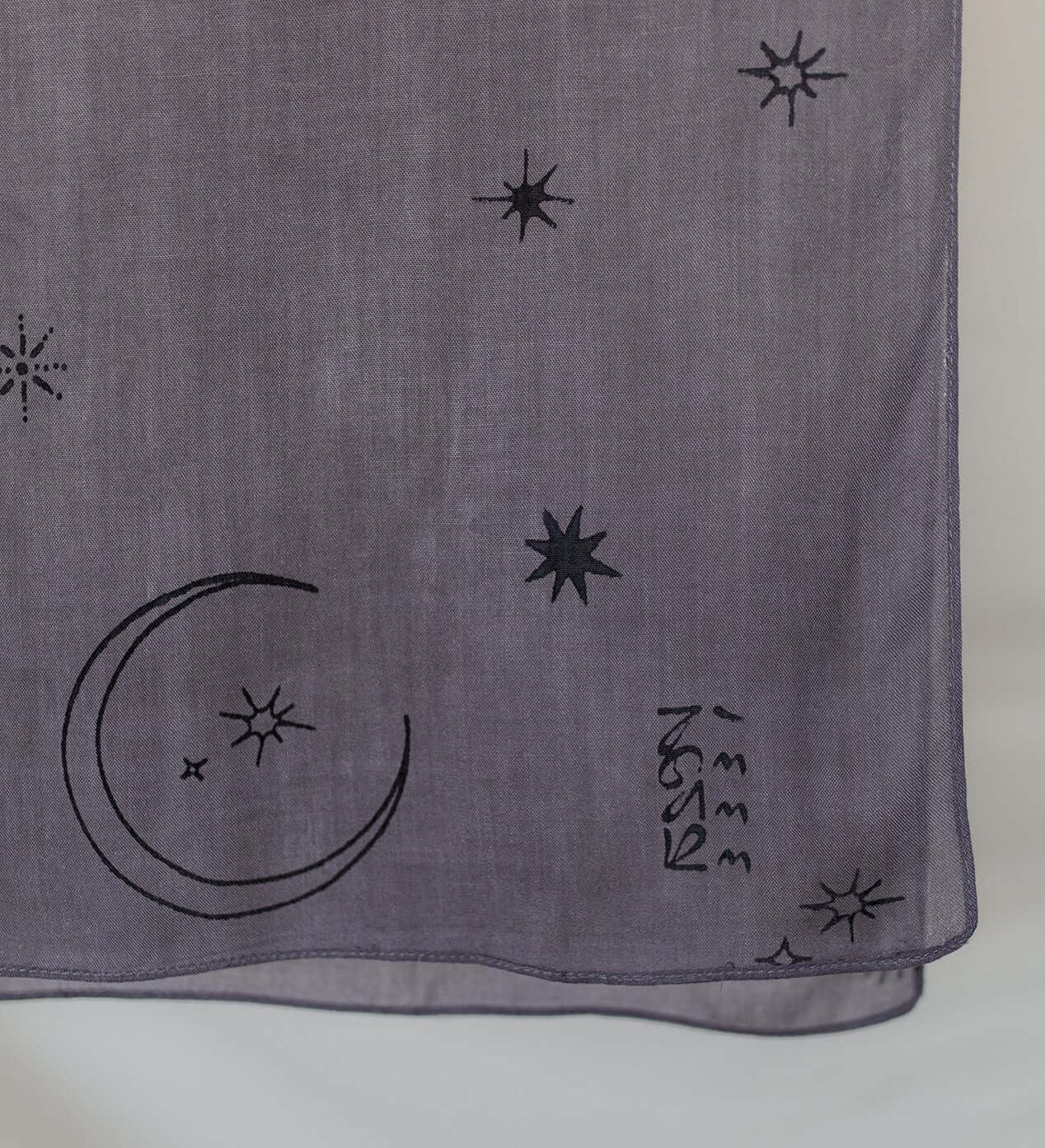 Soft modal hijab with delicate star and moon detailing, perfect for special occasions