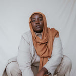 A rich, spiced hijab in Cinnamon, crafted from VELA’s ultra-soft modal for timeless, layered styling