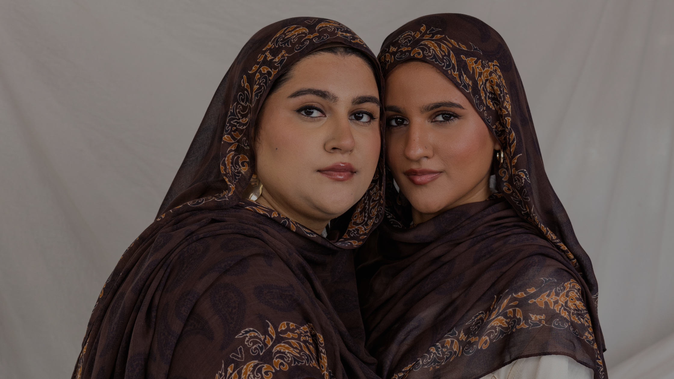 Two models styled in Chocolate Paisley printed hijab.