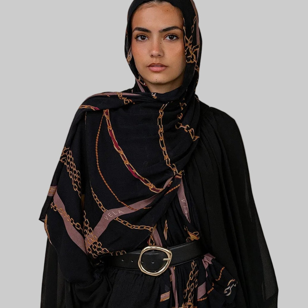 Vintage-inspired scarf featuring an in-house print designed with nostalgic charm.