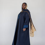 Culturally inspired abaya with full coverage and fine embroidery honoring tradition