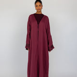 A modern revival of tradition abaya with stitched detail on the back and a breathable finish