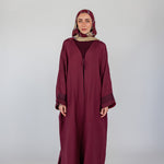 Modern abaya with heritage embroidery and a relaxed, flowing fit for everyday wear.