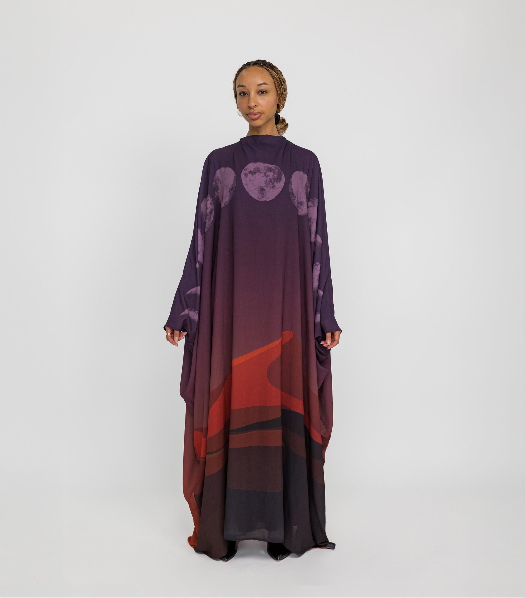 Sheer kaftan abaya with moon phase detailing, inspired by desert skies and lunar cycles