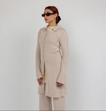 Longline checkered knit cardigan with a tailored fit and soft, breathable fabric.