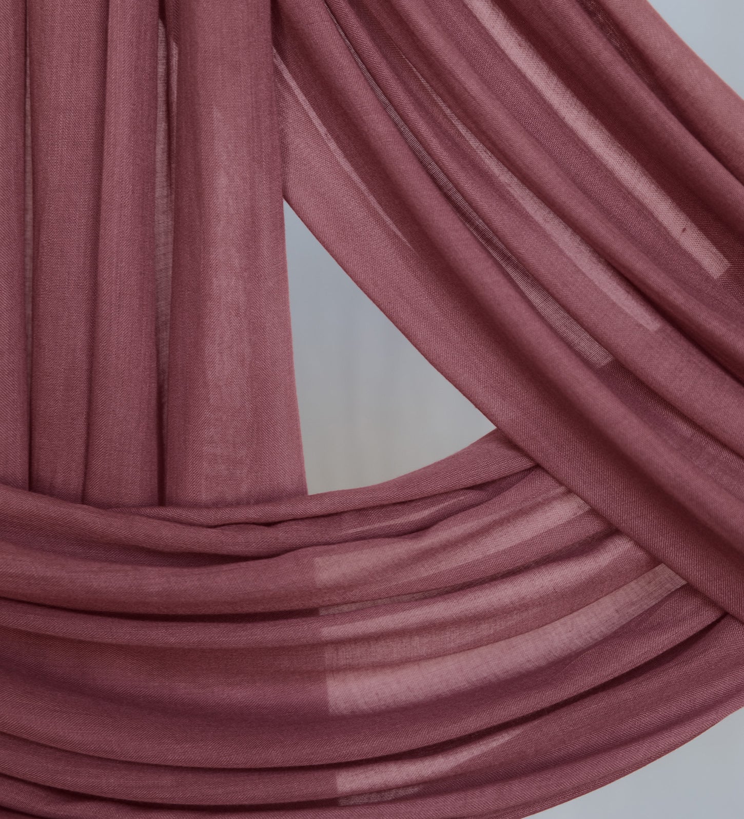 Burnt Clay hijab close up of color and fabric against backdrop.