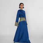 Woman wearing a blue dress with a white background