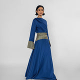 Woman wearing a blue dress with a white background