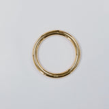 Gold hoop on a light gray background