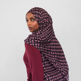 Woman wearing cocoa eclipse hijab on white background