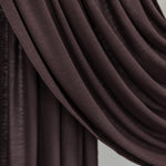 Close-up of a draped brown fabric against a neutral background