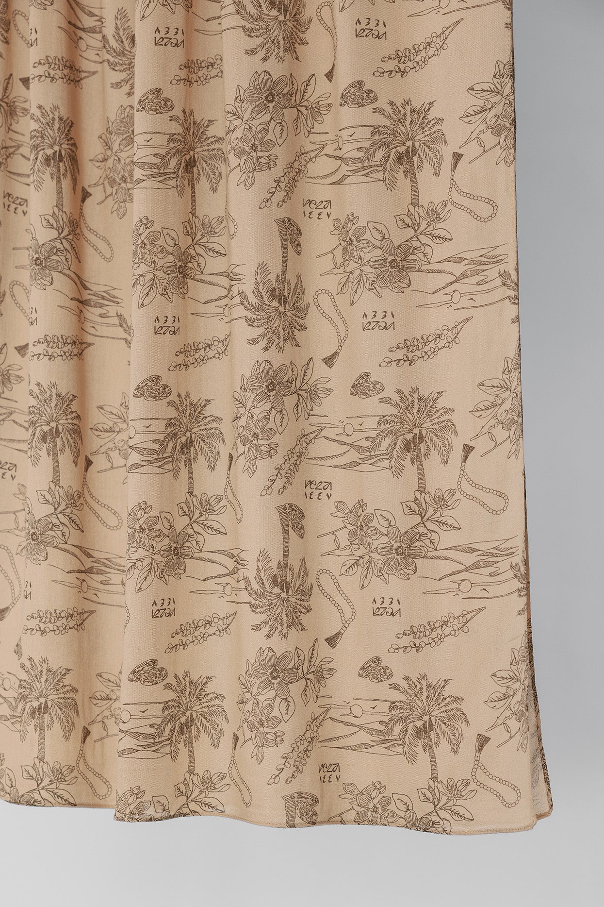 Textile with floral pattern on a beige background
