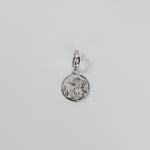 Silver Henna Charm on a light gray background