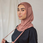 Model wearing Terra Blush Ruching Lite, showing warm pink hue styled in the unruched way.