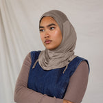 Model wearing Truffle Mink Ruching Lite, showing taupe-grey tone and texture.