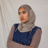 Model wearing Truffle Mink Ruching Lite, showing taupe-grey tone and texture.