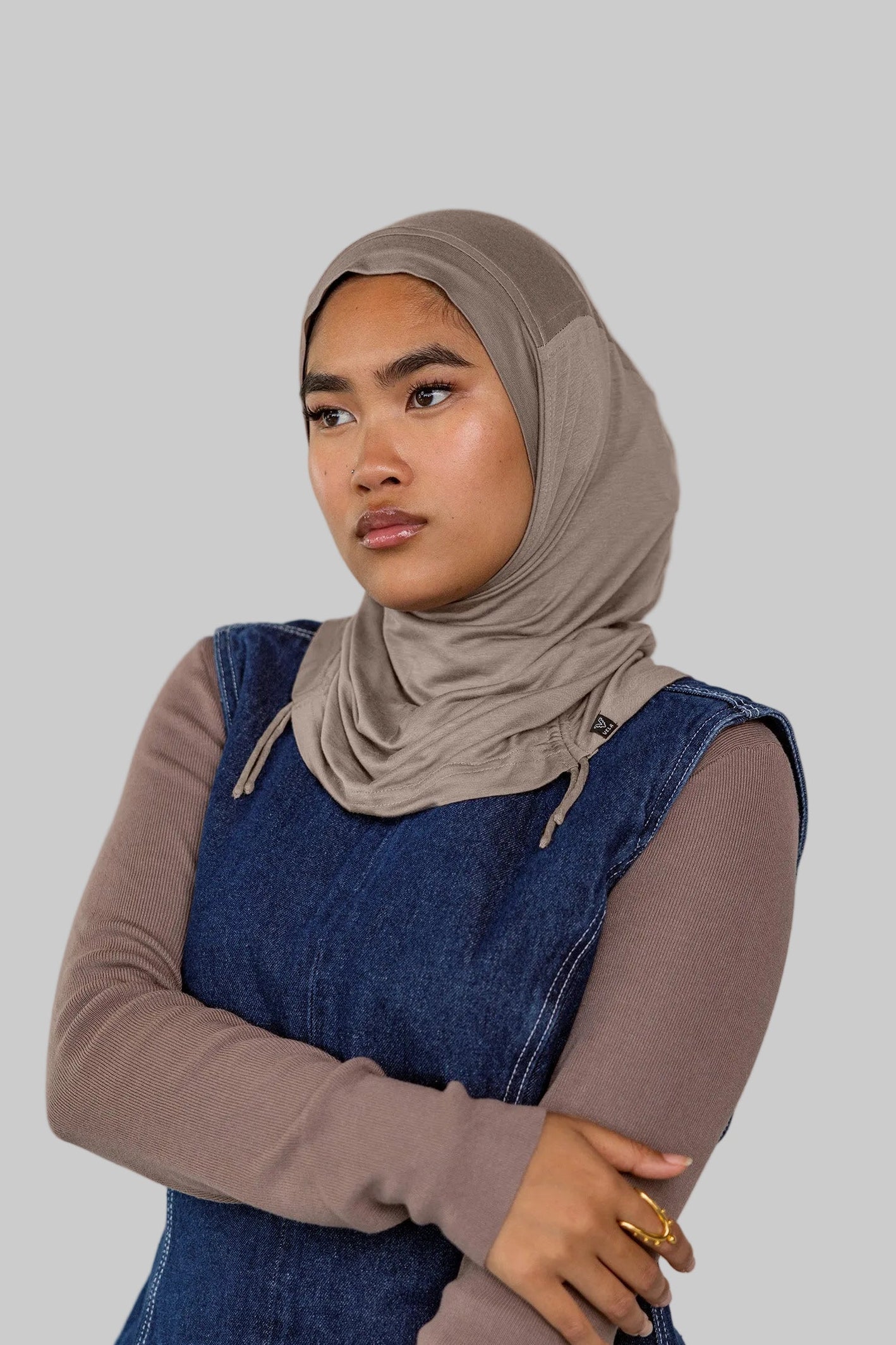 Model wearing Truffle Mink Ruching Lite, showing taupe-grey tone and texture.