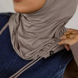 Model wearing Truffle Mink Ruching Lite, highlighting ruching near the edge and soft, lightweight fabric.