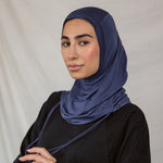 Model wearing Twilight Blue Ruching Lite, highlighting deep navy shade and ruching texture.