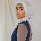 Model wearing Marble Grey Ruching Lite, highlighting the modern grey tone from front facing angle.