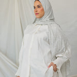  Model wearing Marble Grey Jersey Lite draped neatly, emphasizing its heather grey pattern.