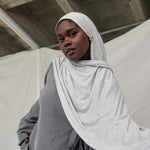  Model wearing Marble Grey Jersey Lite draped neatly, emphasizing its breathable and wrinkle-resistant qualities.