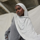  Model wearing Marble Grey Jersey Lite draped neatly, emphasizing its breathable and wrinkle-resistant qualities.