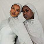 Two models wearing Marble Grey Jersey Lite, highlighting how the heathered grey hue complements different skin tones.