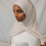 Model wearing Ashwood Jersey Lite in a loose front wrap, showing its versatile neutral hue and stretch.