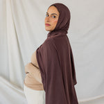 Expecting model looks over her shoulder wearing the Espresso Jersey Lite in standard. 