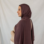 Model wearing Espresso Jersey Lite in a polished style, showcasing wrinkle-resistant and breathable qualities.