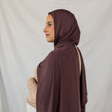 Model wearing Espresso Jersey Lite in a polished style, showcasing wrinkle-resistant and breathable qualities.