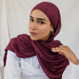 Model wearing Antique Cherry Jersey Lite in a relaxed wrap style, highlighting its deep, berry tone. 