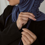 Image depicts model ruching her Twilight Blue Ruching Lite hijab. 