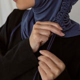 Image depicts model ruching her Twilight Blue Ruching Lite hijab. 