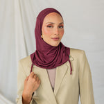 Model wearing Antique Cherry Ruching Lite, emphasizing the deep maroon hue and ruching structure.