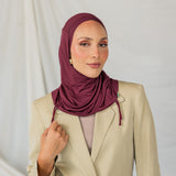 Model wearing Antique Cherry Ruching Lite, emphasizing the deep maroon hue and ruching structure.