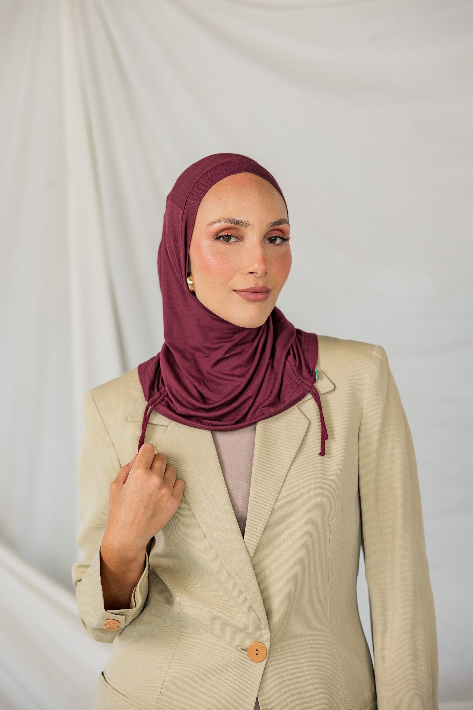 Model wearing Antique Cherry Ruching Lite, emphasizing the deep maroon hue and ruching structure.