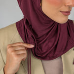 Model wearing Antique Cherry Ruching Lite, featuring ruching at the sides and breathable fabric.