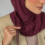 Model wearing Antique Cherry Ruching Lite, featuring ruching at the sides and breathable fabric.