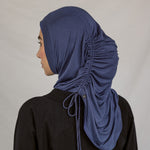 Back view of model wearing the Twilight Blue Ruching Lite hijab, fully-styled.