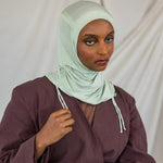 Model shown in front-facing image, wearing the Sage Mist Ruching Lite hijab. 