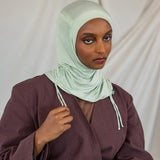 Model shown in front-facing image, wearing the Sage Mist Ruching Lite hijab. 