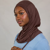 Model wearing Espresso Ruching Lite with ruching along the edge, showing breathable, soft fabric.